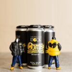 Inspectah Deck Instagram - “Bomb Atomically” DDH IPA is a collaboration effort between @ins_tagrams and Infamous @beer.tape , brewed and packaged by @killsboro #Brewing Company. Gushing with Nectarine, Pineapple, Passionfruit, and Peach, this #beer was double dry hopped with Nectaron, Strata and Motueka. Big mouth feel exploding with citrus and tropical fruit flavor. This limited release is available at our launch event today at the 60 Van Duzer tap room! Tickets available now. Big shout out to @fatohh and @shawnwigs on the art toys #craftbeer #wutang #wutangclan Kills Boro Brewing Company