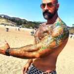 Israel Zamora Instagram - A #beautiful #summer day at the beach yesterday! I got some body painting done #body #art #queer #scruffygay #musclegay #gaysnap #gaydaddy #tattoos #california #zumabeach