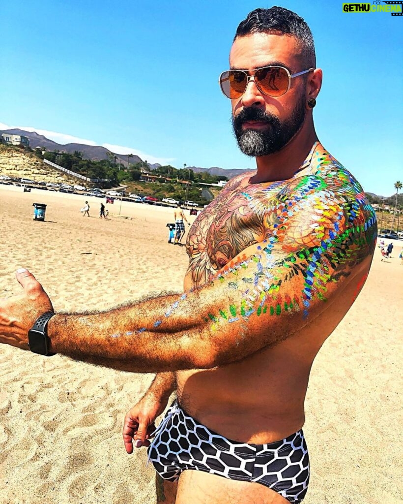 Israel Zamora Instagram - A #beautiful #summer day at the beach yesterday! I got some body painting done #body #art #queer #scruffygay #musclegay #gaysnap #gaydaddy #tattoos #california #zumabeach