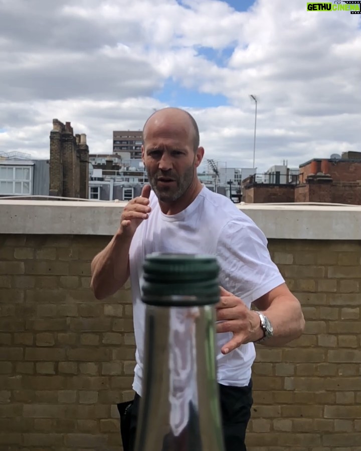 Jason Statham Instagram - #bottlecapchallenge #challengeaccepted @erlsn.acr This thing landed on my head from @johnmayer but will quickly go to a couple of fellas we’ve seen do push ups badly. All yours @guyritchie and @jmoontasri
