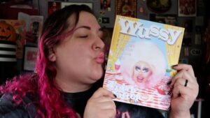 Jen Sutphin Instagram - YOUR REVEREND IS FINALLY IN PRINT MEDIA! And look who's on the cover...

Anyway thanks a million to @annie.t.2.0 and @wussymag for sharing @jamesfundiefridays and my story! It's been such an honor and I am so #blessed to be a part of your really cool publication!!

 Lip color is Bauble/Baby Woman from @trixiecosmetics (I had to ;) ) 

-Link to purchase this issue is on my linktree in my bio 

Happy Halloween and thank God for @wussymag !! 🎃🌈