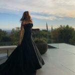 Jennifer Aniston Instagram - Last night. My little women. Supported me all night. (Had enough room for them and then some under that gown 🥳) Thank you @Dior for this stunning piece of art 🖤
