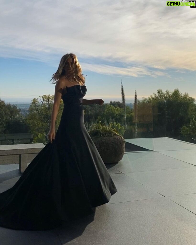 Jennifer Aniston Instagram - Last night. My little women. Supported me all night. (Had enough room for them and then some under that gown 🥳) Thank you @Dior for this stunning piece of art 🖤