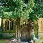 Jennifer Finnigan Instagram - Touring around the beautiful #cotswolds , this is the entrance to #stedwardschurch in #stowonthewold Parts of this church dates back to the 11th century. This entry point is The Hobbit Door, flanked by two Yew trees. Apparently it inspired JR Tolkien!! So freaking cool…and absolutely stunning 😍….also England’s oldest Inn!?! #geek #historynerd #england 🇬🇧 Stow On the Wold, Cotswolds