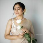 Jisma Jiji Instagram - 📸: @athul_krishna________ STYLED BY: @andriya_nunez OUTFIT : @acornfashionlines MUA: @reema.muneer #lookoftheday #jismaandvimal #jisma #jismajiji #jismavimal #makeuplook #weddingguest #saree #sareelove #sareelooks #sareelook #beigesaree #photoshootideas