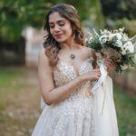 Jisma Jiji Instagram - “Crafted for the radiant @jisma_jiji_kizhakkarakattu : An A-line masterpiece, adorned with exquisite lace and a star-worthy slit.” This gown, designed for the radiant celebrity @jisma_jiji_kizhakkarakattu is nothing short of a work of art. Its A-line silhouette exudes timeless elegance and sophistication, while the gown’s true allure lies in the intricate lace detailing that adorns it. The lacework is a testament to exquisite craftsmanship, adding a touch of opulence and a sense of intricate beauty to the design. To complete the look, a sultry slit graces the gown. #wedding #celebrity #customisation #weddinggown #weddinggowns #weddinggowndesigner #bridal #bride #celebritystyle #celebritywedding #bridesofinstagram #celebritybride #slit #tulle #tullegown #lace #lacegown #couture #couturebride #couturebridal #weddingsofinstagram #explore #explorepage #fyp #lovestory #weddinginspiration #weddingideas #bridalinspiration #influencer #influencerstyle