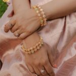 Jisma Jiji Instagram - Pretty pastels & the shimmer of gold. Meenakari work in pastel pink gives a beautiful aura to these pieces from @lakshmijewellery916. Perfect to add that aura of elegance to your look, @lakshmijewellery916 has the best collection of meenakari ornaments ! Visit @lakshmijewellery916 today, to get your hands on their latest collection of designer jewellery ! Costume courtesy: @parishkaari_official