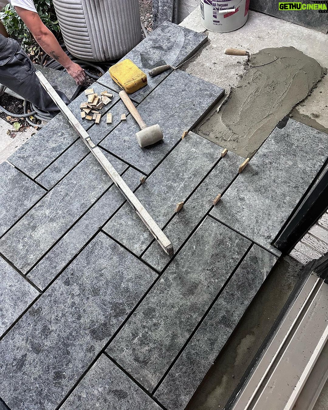 John Colaneri Instagram - #Design is all in the details and the stone work that we did around our home created a major change. When looking to update the exterior of your home always add different textures and materials. This will allow those elements to play off of each other. The earth tones from the new @jameshardie siding and the black granite from @polycor_hardscapes are two materials that work very well together. #curbappeal #exteriordesign #stoneveneer #stonework #designgoals #designinspiration #njdesigner #njbuilders