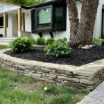 John Colaneri Instagram - Busy weekend at the #colanerihome finishing up the stone projects around the yard! Grass is starting to grow in nice and mulch is down to clean up the beds. The stone supplied from @northernvalleystone is on point and I could not be happier with choices I made. The new stacked stone walls make such a big change! Wait until I show you the landscaping lighting! Let’s get the summer projects underway! #lovetheprocess #landscape #landscapedesign #landscapedesigns #stonedesign #stonework #design #designinspiration #designgoals