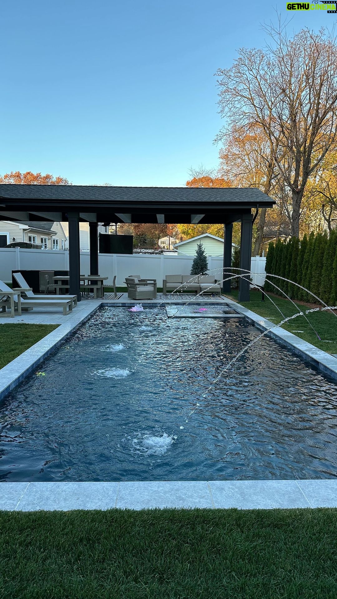 John Colaneri Instagram - My clients pool and backyard patio are complete! The countertop by @sapienstone_usa fabricated by @faithfulcountertops was installed today and it looks incredible! I love the entire vibe of the space and I know come next summer this space is going to get a lot of use. Great work by @aquaticpoolmanagement on getting the pool installed! Let’s do another! Onto the next project! #backyard #backyardgoals #backyardoasis #design #designgoals #designinspiration #njdesigner #njbuilders