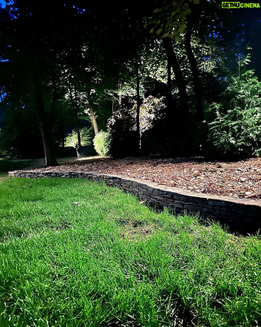 John Colaneri Instagram - Stone walls are complete for summer and #architectuallightingdesign is in full effect! When working with #naturalstone on your property you can get amazing shadow effects when lit at the right angles. I have become obsessed with #landscapelighting and proud of it! LOL. #landscapedesign #stone #stonedesign Stone by @northernvalleystone