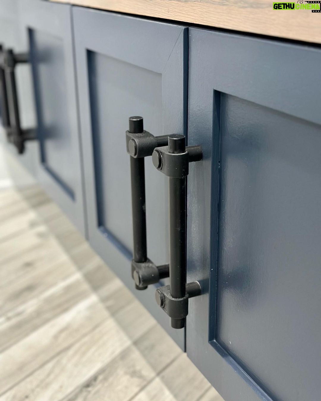 John Colaneri Instagram - My clients mudroom has been updated with custom cabinet doors and hardware. All have been painted with one of my favorites by @benjaminmoore called Mysterious AF-565 and hardware by @busterandpunch. There is a ton of storage and this color really transforms the space. The black hardware is so unique and will be a conversation starter for sure! #custommillwork #design #designinspiration #designgoals #mudroom #mudroommakeover