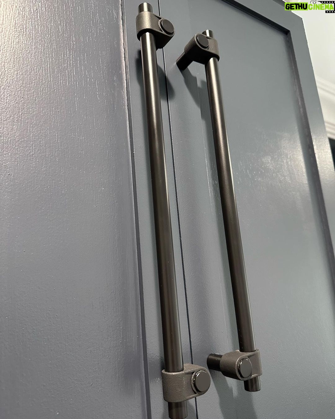 John Colaneri Instagram - My clients mudroom has been updated with custom cabinet doors and hardware. All have been painted with one of my favorites by @benjaminmoore called Mysterious AF-565 and hardware by @busterandpunch. There is a ton of storage and this color really transforms the space. The black hardware is so unique and will be a conversation starter for sure! #custommillwork #design #designinspiration #designgoals #mudroom #mudroommakeover
