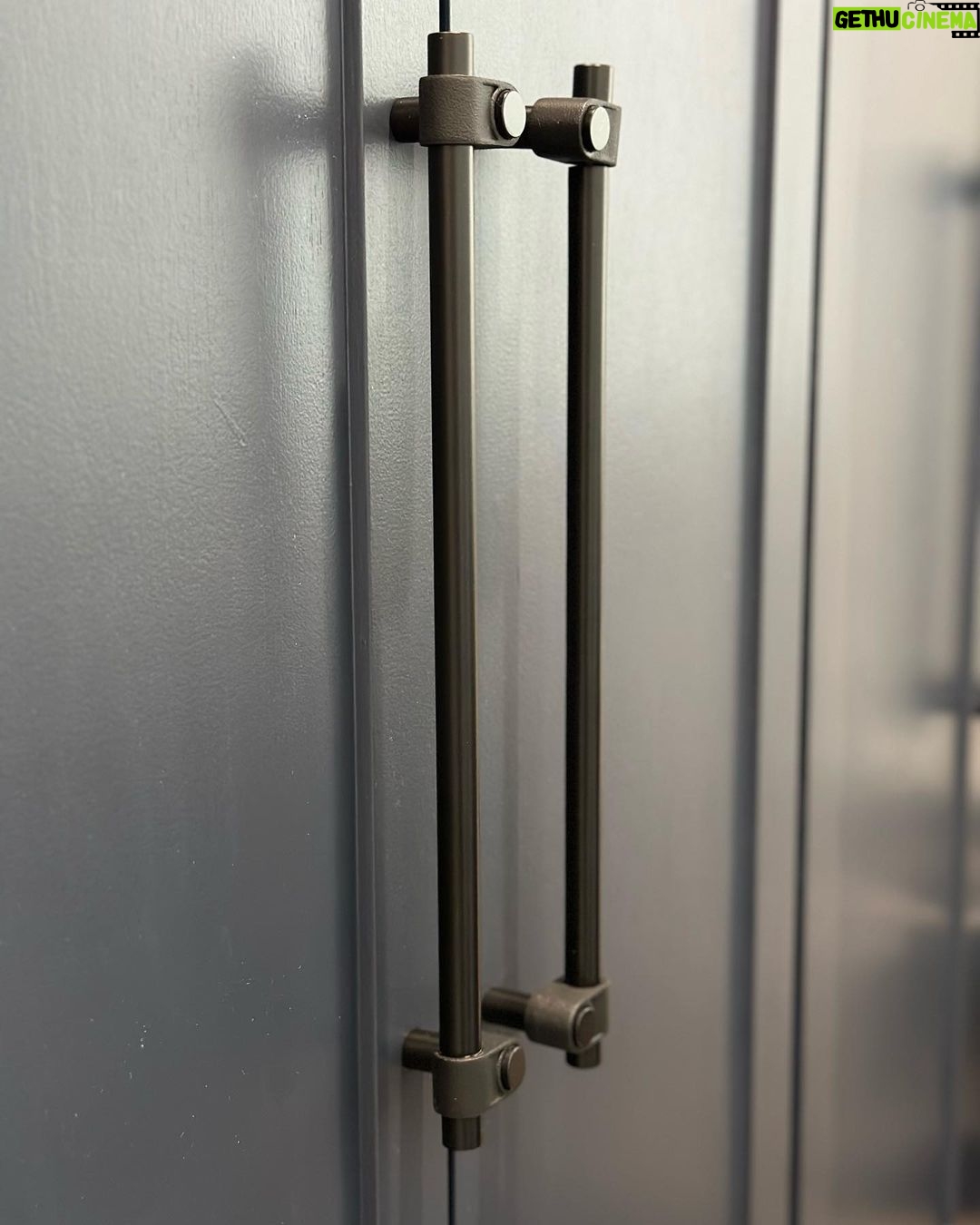 John Colaneri Instagram - My clients mudroom has been updated with custom cabinet doors and hardware. All have been painted with one of my favorites by @benjaminmoore called Mysterious AF-565 and hardware by @busterandpunch. There is a ton of storage and this color really transforms the space. The black hardware is so unique and will be a conversation starter for sure! #custommillwork #design #designinspiration #designgoals #mudroom #mudroommakeover