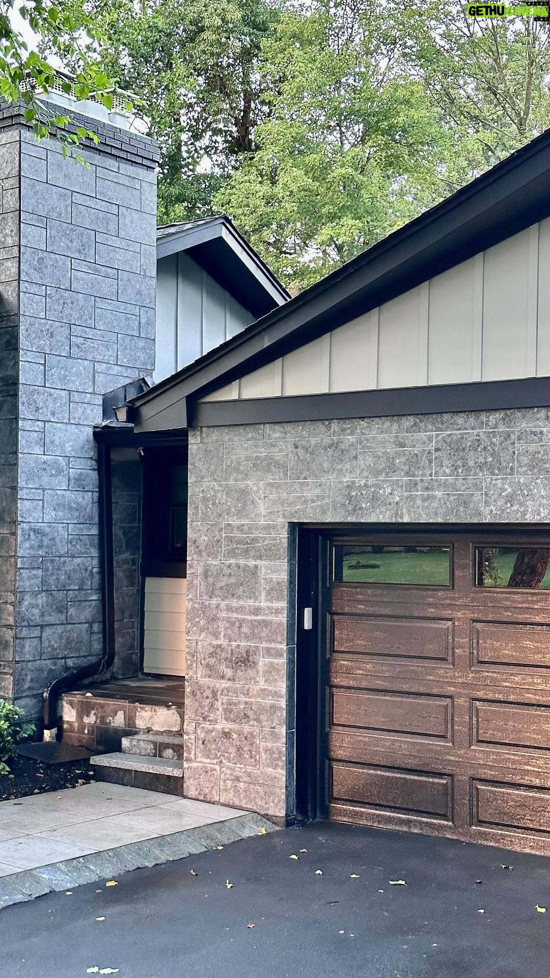 John Colaneri Instagram - Summer #exteriorrenovation complete!! What should I do next? New siding by @jameshardie in Stone Paver color (Magnolia line) New patio and stone accents by @polycor_hardscapes in St. Henry Black Granite #curbappeal #designtrends #designinspo #designer #renovation