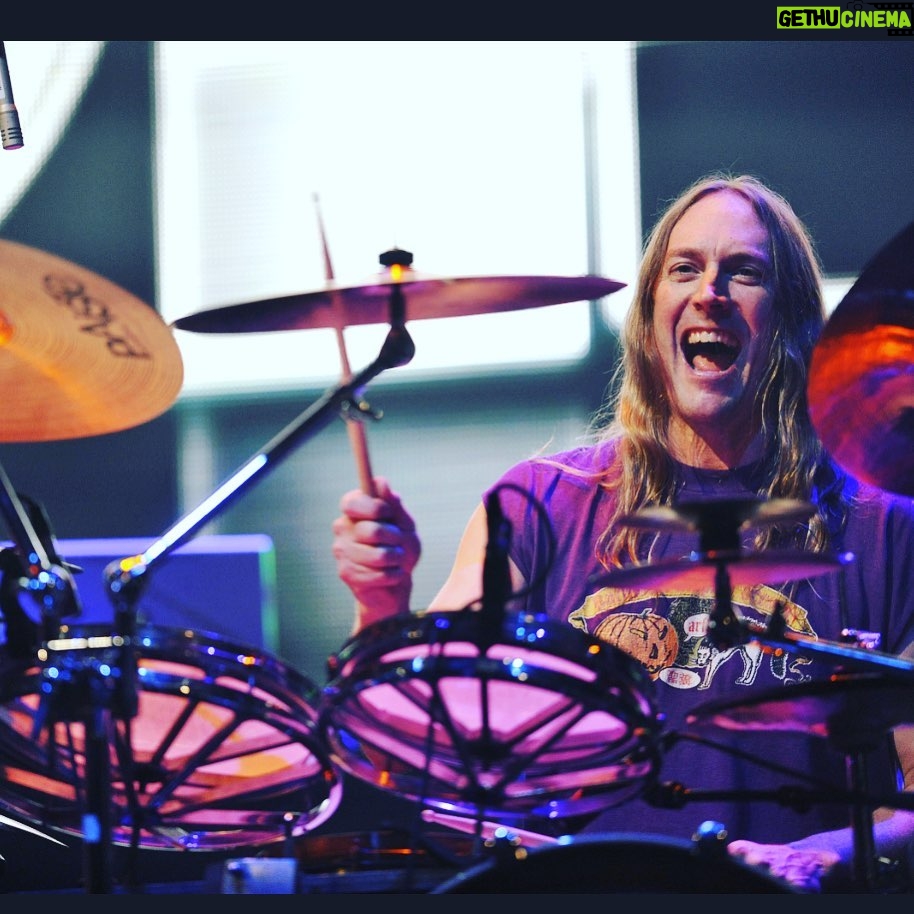 John Dolmayan Instagram - Even before I joined the band we would sit around and marvel at the uniquely intricate drumming of Danny Carey . Tool to me is like a mix of Pink Floyd and Rush, modernizing those sounds and adding an even more prolific singer . I spent many nights in the crowd during Ozzfest laying on the grass and enjoying the power and beauty amplified by the massive speakers . (Their Led Zeppelin cover is amazing !)At some point someone had the bright idea of challenging them to a basketball game ( we lost ). This was the second time system lost ( first time was to slayer , they killed us ) but we began a friendship between the bands that is still thriving today. Danny is on the Mount Rushmore of modern drummers , he balances technic and style perfectly . For someone as tall as he is he’s incredibly graceful and there is a marvelous liquidity to his drumming style . Danny is a shy , introspective person but once you get him comfortable his inner joy and zest for life overtakes you. I have been fortunate to have played with them on stage going back and forth on timbales as he played a solo. Every time we did this was such a thrill and again I count my blessings that these opportunities have been afforded to me. I can’t explain how much respect and admiration I have for Danny and Tool in general . I pray we do a tour together one day and create a massive 2 or 3 drummer solo . I promise to give you a run for your money Danny 🤙