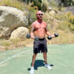 John Feldmann Instagram - When I was a kid I hated sports. Always the last guy to be picked on the team. I had my jaw broken by the quarterback of my high school football team. I played the clarinet and I was OBSESSED with punk rock. I moved to Los Angeles in 1988 and I found my people. Weirdos and freaks. Then I found Fishbone and the Red Hot Chili Peppers. I realized that music could also be an athletic event. I started working out when I was 21. I’m 54 now and have never been in better shape. I know now that working out is a lifestyle. It combats my anxiety, my depression, and is part of my overall mental health plan. Every morning I pray to my HP, take a cold plunge, and say “I LOVE MY LIFE” as loud as I can whether I believe it or not. It works. It really does. Never give up on yourself! I’m so glad I didn’t… Thank you @amy_feldmann and @dr_cp for taking these pics of me today during my morning workout regime. Thank you @glennholmesla for pushing me to be the best version of myself. Calabasas, California