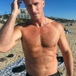 John Hill Instagram - I’m trying to think of a cute caption while my dog poops anyway happy new year from the beach Malibu, California