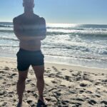John Hill Instagram - I’m trying to think of a cute caption while my dog poops anyway happy new year from the beach Malibu, California