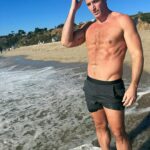 John Hill Instagram - I’m trying to think of a cute caption while my dog poops anyway happy new year from the beach Malibu, California