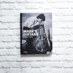 Johnny Marr Instagram - After selling out due to overwhelming demand, ‘Marr’s Guitars’ is now back in stock and available while supplies last. Head to the link in our profile to get your copy now 🔗 Tracing Marr’s career from his teenage years to his recent work on the Bond soundtrack, this unmissable book showcases the most significant of Marr’s superb collection of guitars, revealing through them the evolution of his iconic sound and style of playing. @johnnymarrgram
