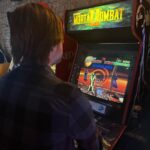 Jon Lajoie Instagram – Love this album art by @fredheidbrink for the Wolfie’s Just Fine song “Mortal Kombat 2.” Check my previous post for the full video. 
p.s. This is me playing MK2 at @logan_arcade in Chicago last month. The machine there is in flawless condition. So fun.