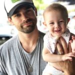 Justin Gaston Instagram – When your baby has to wear a bib because she has a blowout in the car and you forgot to bring extra clothes. 🤦🏻‍♂️ #dadlifeyo