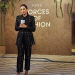 Karisma Kapoor Instagram - True fashion isn't just about what you wear, it reflects your inner self. Thank you @vogueindia @rochelle.pinto for this special night ✨and accolade. It is an honour to be considered one of the Forces of Fashion in India 🙏🏼🖤 Picked out some clothes and accessories from my closet. A sharp suit by @eliesaabworld , an old shirt by @otherstories , my intricate limited edition box clutch by @jimmychoo ( Circa 2011 ) @louisvuitton ring ( Circa 2015 ) and one of my fav comfy gold pumps @alexandrebirman #ForcesOfFashion #BeUrself