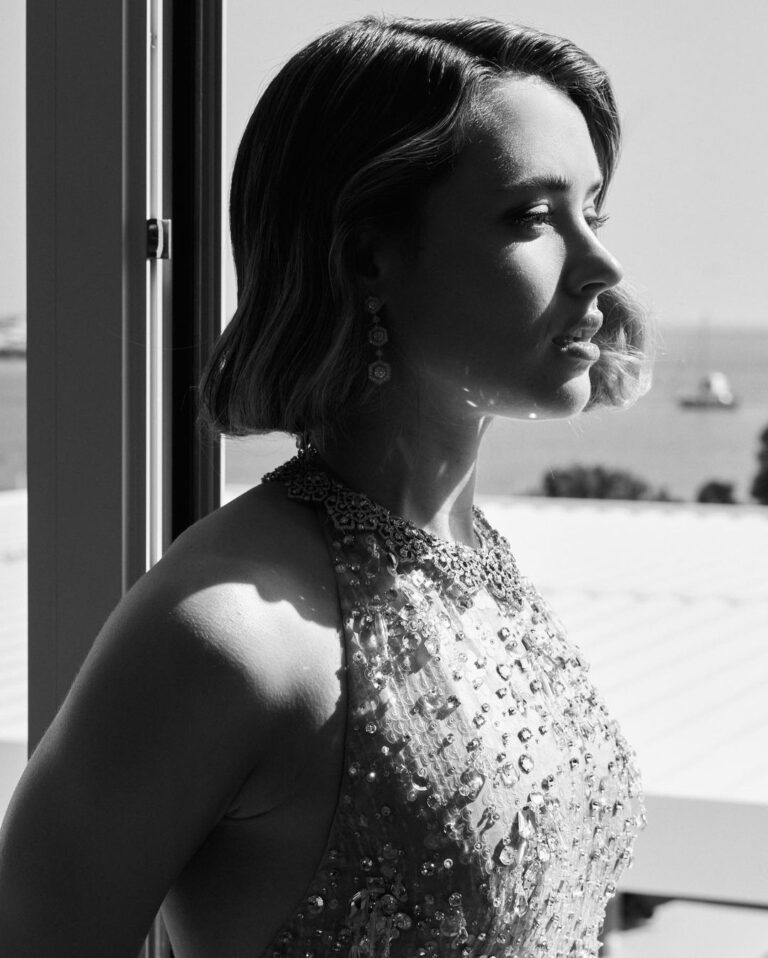 Katherine Langford Instagram - @katherinelangford for @lorealparis in custom @prada and @bulgari jewels, photographed at the 76th Cannes Film Festival. Styled by @mollyddickson, hair by @stephanelancien and make-up by @thevalgarland. #KatherineLangford #LOreal #Prada #Bulgari #Cannes #CannesFilmFestival #Leica #GregWilliamsPhotography #GregWilliams