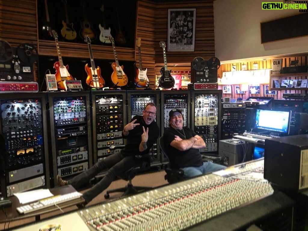 Kiefer Sutherland Instagram - Behind the scenes of 'Bloor Street - from the Recording Studio. I think the kids call this a #Photodump image 1 -  This is Chris Lord Alge and myself in the control room of his studio working on the final mix. Why I make stupid gestures with my hands will be a mystery to me ‘til the bitter end. image 2 -  Jess Calcaterra giving Cindy Vela percussion lessons… and loving it! image 3 -  Jim Scott’s Studio/vintage gear museum. Also has a bar, which I thought very civilized.   image 4 -  The irony of this photograph is that when I go to do a vocal I remove my glasses and this is literally what I see… Ha ha ha!