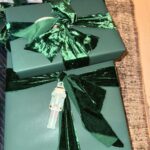 Kim Kardashian Instagram - Wrapping gifts in our family is always such a fun family tradition to see what each family member did and their vibe for the year. Each represents us so well! I did all white SKIMS cotton jersey t shirt fabric. I’m excited to reuse it and make other things. Kylie did a festive Santa print. Kravis a simple green cool wrapping. My mom a shiny metallic red wrapping. Kendall did a chic blue and white print with green bow. Rob wrapped everything in a festive snowman print with a white bin that has these soft ball shape. Khloe did a gorgeous monochromatic green with green ribbon.