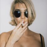 Kourtney Kardashian Barker Instagram - bye bye blondie. one more smoking hot post for the haters. shoutout to my prop provider and photographer @kulikulikulik 🚭