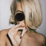 Kourtney Kardashian Barker Instagram - bye bye blondie. one more smoking hot post for the haters. shoutout to my prop provider and photographer @kulikulikulik 🚭