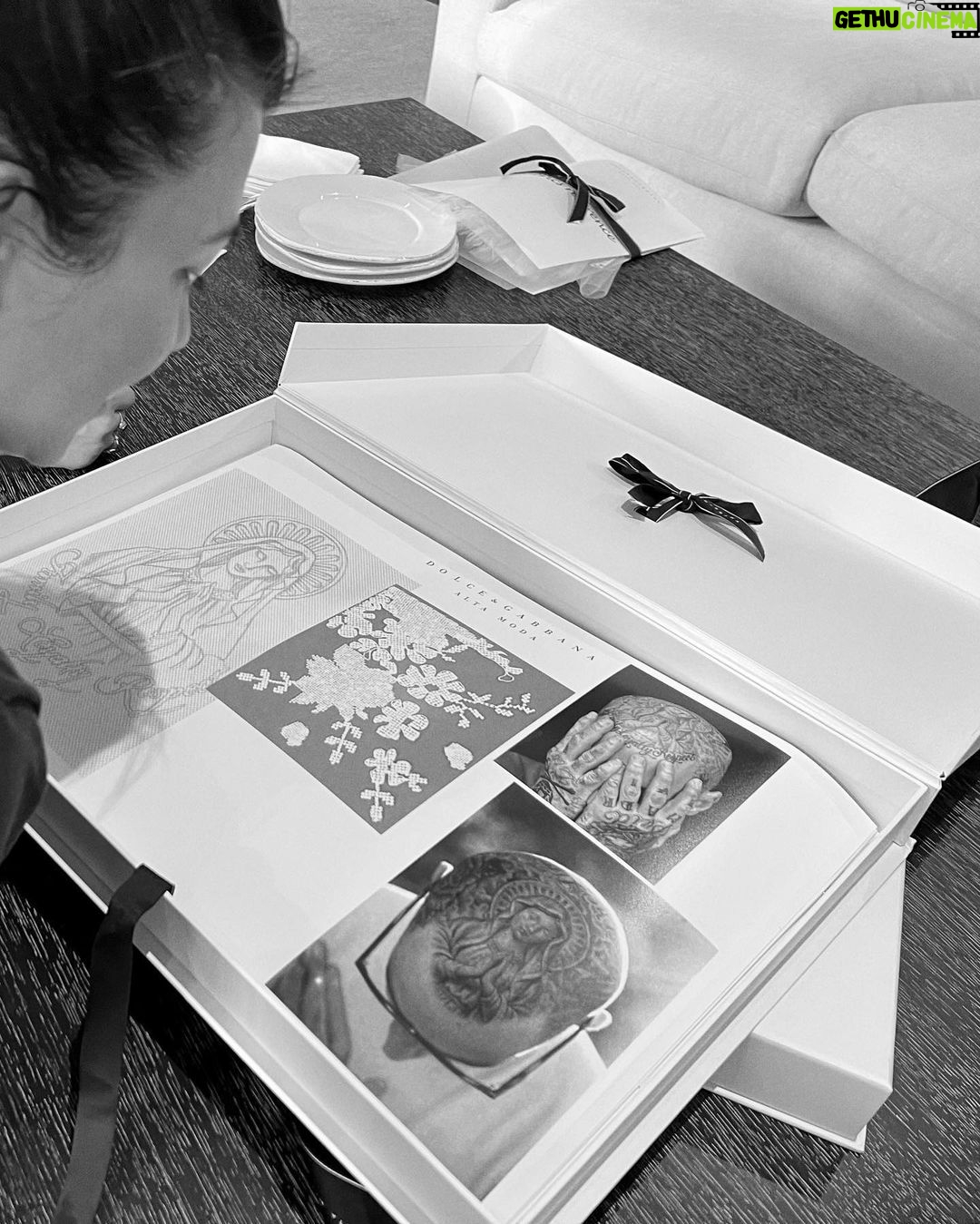 Kourtney Kardashian Barker Instagram - One year ago, we had our first in-person meeting with @dolcegabbana to start the design process of my wedding dress!! The first inspiration for my dress was when Travis and I were watching Guns N’ Roses November Rain video one night before we were even engaged, and we said to each other “this has to be our wedding.” She was wearing a short dress and I thought to myself “I need a short dress!” I had more visions inspired by some 1990s campaigns of Monica Bellucci shot by Helmut Newton for Blumarine. When we knew our wedding was going to be in Portofino, it also influenced the vibes and feeling of the dress. I also just wanted to feel like we ran off to Italy and got married and wanted the dress and wedding to feel that way! When @dolcegabbana suggested putting Travis’s head tattoo of the Virgin Mary on the handmade lace veil with the words from his tattoo: family, loyalty, respect underneath, I got chills and knew how special that felt. (And my little mini veil I wore to dinner ☺️) This was all planned and made into my dream come true all so so quickly and I’m so grateful to everyone who put their all into making it all happen! ✨🫶🏼❤️