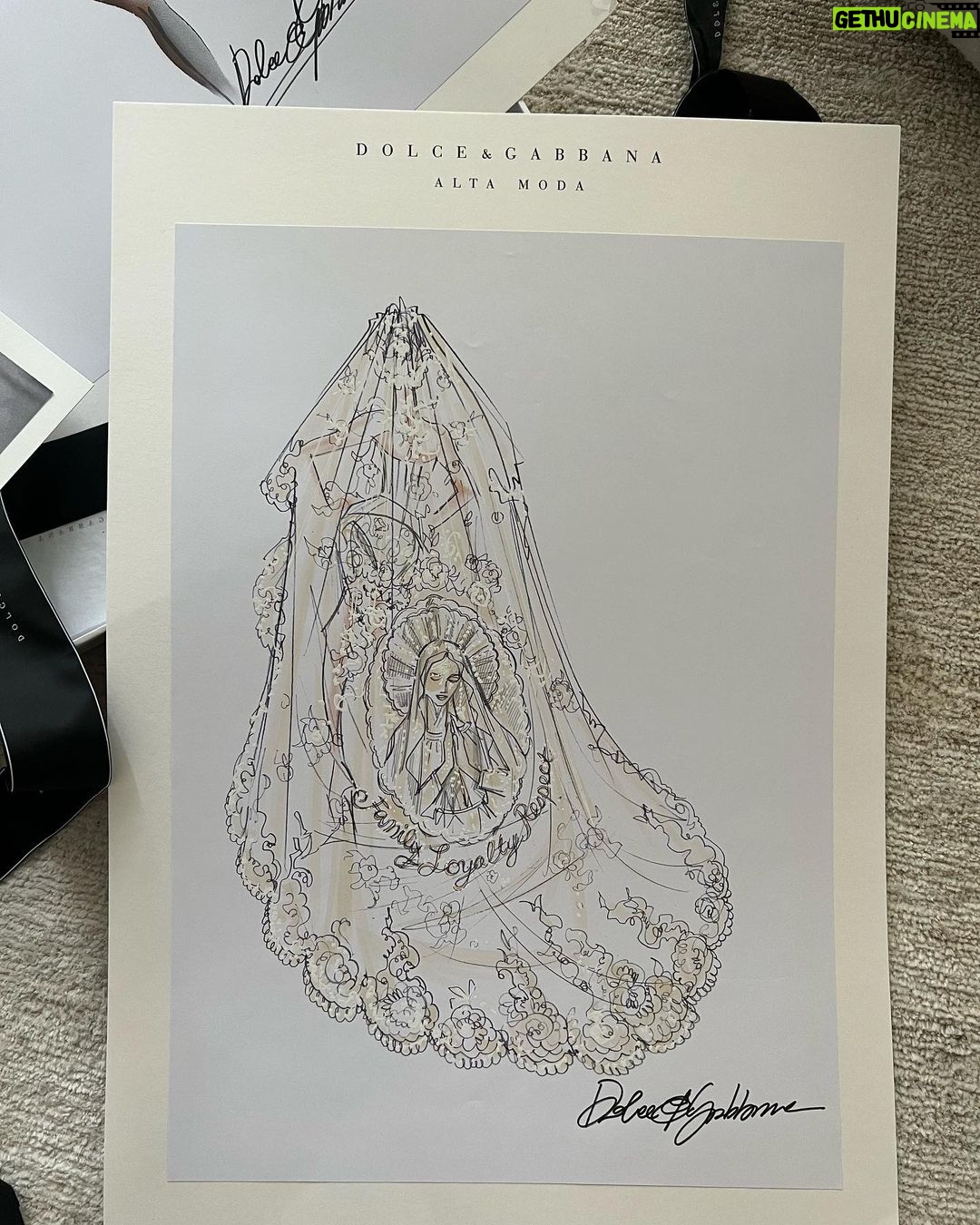 Kourtney Kardashian Barker Instagram - One year ago, we had our first in-person meeting with @dolcegabbana to start the design process of my wedding dress!! The first inspiration for my dress was when Travis and I were watching Guns N’ Roses November Rain video one night before we were even engaged, and we said to each other “this has to be our wedding.” She was wearing a short dress and I thought to myself “I need a short dress!” I had more visions inspired by some 1990s campaigns of Monica Bellucci shot by Helmut Newton for Blumarine. When we knew our wedding was going to be in Portofino, it also influenced the vibes and feeling of the dress. I also just wanted to feel like we ran off to Italy and got married and wanted the dress and wedding to feel that way! When @dolcegabbana suggested putting Travis’s head tattoo of the Virgin Mary on the handmade lace veil with the words from his tattoo: family, loyalty, respect underneath, I got chills and knew how special that felt. (And my little mini veil I wore to dinner ☺️) This was all planned and made into my dream come true all so so quickly and I’m so grateful to everyone who put their all into making it all happen! ✨🫶🏼❤️
