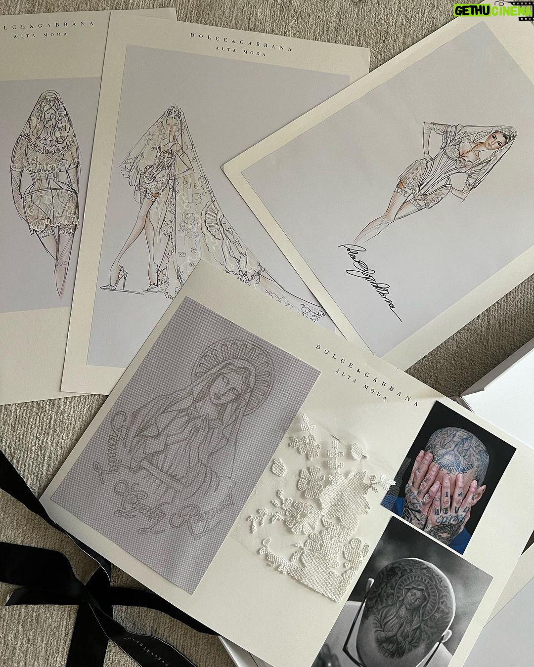 Kourtney Kardashian Barker Instagram - One year ago, we had our first in-person meeting with @dolcegabbana to start the design process of my wedding dress!! The first inspiration for my dress was when Travis and I were watching Guns N’ Roses November Rain video one night before we were even engaged, and we said to each other “this has to be our wedding.” She was wearing a short dress and I thought to myself “I need a short dress!” I had more visions inspired by some 1990s campaigns of Monica Bellucci shot by Helmut Newton for Blumarine. When we knew our wedding was going to be in Portofino, it also influenced the vibes and feeling of the dress. I also just wanted to feel like we ran off to Italy and got married and wanted the dress and wedding to feel that way! When @dolcegabbana suggested putting Travis’s head tattoo of the Virgin Mary on the handmade lace veil with the words from his tattoo: family, loyalty, respect underneath, I got chills and knew how special that felt. (And my little mini veil I wore to dinner ☺️) This was all planned and made into my dream come true all so so quickly and I’m so grateful to everyone who put their all into making it all happen! ✨🫶🏼❤️