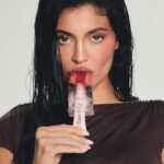 Kylie Jenner Instagram - dropping 3 new shades of our award winning GLOSS DRIP for the summer ! 💦 the best juicy, reflective, mirror-shine gloss that lasts extra long on the lips 🫶🏻🫶🏻 i can’t wait to show you these yummy new shades. so yummmyy i could eat it 😜 coming august 8th ! @kyliecosmetics