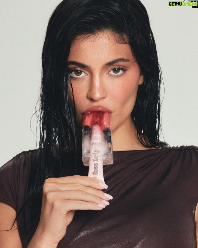 Kylie Jenner Instagram - dropping 3 new shades of our award winning GLOSS DRIP for the summer ! 💦 the best juicy, reflective, mirror-shine gloss that lasts extra long on the lips 🫶🏻🫶🏻 i can’t wait to show you these yummy new shades. so yummmyy i could eat it 😜 coming august 8th ! @kyliecosmetics