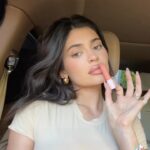 Kylie Jenner Instagram - in love with my tinted butter balms 🫶🏻 wearing shade ‘Love That 4 U’ sooo hydrating and buttery smooth. available now KylieCosmetics.com @kyliecosmetics
