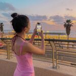 Lévanah Solomon Instagram - 💖🎶Let’s stay like this forever 🕶️💗 (Cette chanson>>>>>>) #sunset #night #travel #pink #yellow #blue #purple #pastel #vacation #holiday #summer #beach #girl #palmtrees #mileycyrus Tel Aviv Beach