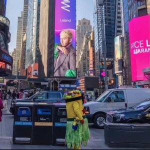 Leland Instagram - TIMES SQUARE!! thank you @spotify for including me in the  launch of GLOW, a year round, global initiative to promote and celebrate LGBTQIA+ artists.  It’s taken me longer than I planned to find the fearlessness in myself that I’ve seen in so many queer artists I’ve had the pleasure of working with.  But I have arrived and I’m not going anywhere!  Stream “Bad At Letting Go” and all the incredible artists on the GLOW platform! (Also not this minion coming for my outfit!) 💚