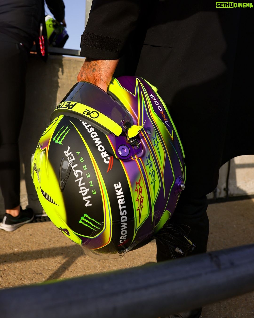 Lewis Hamilton Instagram - 2023 HELMET — Going with both yellow and purple this year. Love how they look together and how sick it looks against the black car. Keeping the rainbow accents too, always 🏳️🌈