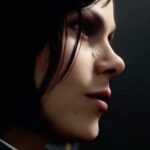 Lily Cowles Instagram - When I was about 11 years old, some unsuspecting family member gifted me Tomb Raider III for my iMac, and I never looked back. Proof that women could be brilliant, ballsy, and badass—with a great ass—Lara Croft was my first girl crush and the last video game character I ever played. Because I got stuck in the jungle and couldn’t make it to the next level and eventually moved on with my life. But I never forgot her. In fact I subconsciously modeled my life after her. Now, decades later, I have the immense pleasure of embodying my very own badass female hero: agent Helen Park, of MI6. Working on Park was the joy of 2020 for me, and I’m so grateful to all those who helped bring this character to life in the newest installment of Call of Duty: Black Ops Cold War. Thank you @callofduty @isenbergcasting @ravensoftware @treyarch @activision, @amandawped @drktrick @mikecurranart @daveb2 and all the amazing crew who dedicated their time and attention to this epic game. To my mates in combat: @mr.brucethomas @coachwithreg @damondayoub @damonvallen_ @chrispaynegilbert @piotr.michael ... we’ve got a job to do. One final thought: thank you to the designers who insisted on keeping my mole for Park. A mole that was the source of much criticism and disgust my first few years as an actor. That hours would be put into digitally recreating my mole, frame after frame, warms my heart 🟤 Berlin, Germany