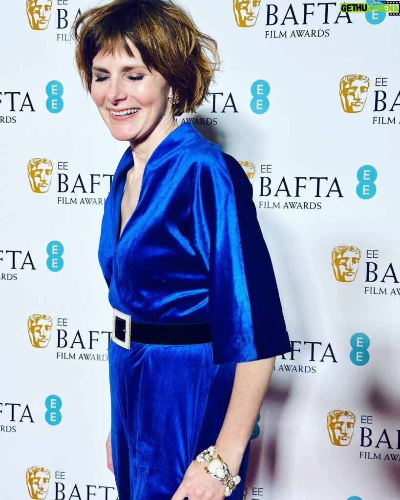 Louise Brealey Instagram - So proud of our little film. To see Brian and Charles dancing in the kitchen on the giant screen with Cate Blanchett, Viola Davis, Michelle Yeoh and Julianne Moore in the house eating chocolate BAFTA faces well that was magic. I have a lot of people to say thank you to who made me look presentable on the red carpet. Prepare for hyperbole. It takes an army. First. My friend and Pygmalion @mary_fellowes who spends her life now working tirelessly to make fashion more sustainable and less hideously polluting. She lent me my heavenly blue vintage velvet and assembled the crack team tasked with my transformation. Without her I would be just posting a picture of my dessert. Hair by amazing @gillsondavid at @issysbelgravia - he is quite frankly a magician. Thank you SO much, David! I can’t stop stroking my nails thanks to Joan (@nails.issys) they are like beautiful seashells on the ends of my funny sparrow claws. Stylists! Magazines! Publicists! Use South African maestro @lesleywhitbymakeup - who has just decamped to London - for everything. A massive thank-you to antique jewellers @susannahlovisjewellers who have a shop in Burlington Arcade and who trusted me with unbelievable shiny things. A gold and diamond panther bracelet from 1980 I called John. A Cartier claw ring and a star burst of diamonds in my ears. Thanks to them I thrust the panther in everyone’s face all night and no one thought I was weird. Right I’d better get these fake eyelashes off. Happy Monday, Kids. Royal Festival Hall