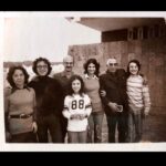 Maria Hinojosa Instagram - This foto right here is my life. Mi vida. Tampico. 1970s. Mi abuelito. My gorgeous parents. My fly sister. My cool bros. And me. I think I was trying to fit in with American kids by trying to like sports. I think this is a hockey jersey. Well, because I lived in Chicago then. Hockey, of course. My cousins from Mexico sent this last night in our chat abt our Tampico memories when about 20 of us would gather for summer or Christmas celebrations and I just wanted to share. This is the real me. 🇲🇽