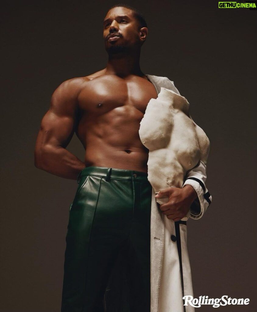 Michael B. Jordan Instagram - Creating a chapter in Adonis’ journey has helped me realize the strength in myself and being a master of my own universe. Exploring all the characters narratives and how they navigate the different parts of themselves made me more aware of the different personalities that live inside my soul. Thank you to Adrienne for capturing these dimensions and thank you to Rolling Stones for allowing me to share my story. @Rollingstone Photographer @adrienneraquel x @sn37agency Writer @carvell_wallace Creative Director @Joe_Hutchinson Director of Photography & Deputy Creative Director @Emma.V.Reeves Fashion Direction @Thealexbadia Deputy Photo Director @slecca Senior Visuals Editor @photoeditorjoe Head of Video @kimberlyaleah Video Producer @ilanawoldenberg Video DP @helkifrantzen Director of Social Media @waiss_aramesh Market Editor @luiscampuzano Producer @petty_cash_production Production Designer @paidfollower001 Face & Chest Sculpture and Body paint by @hollysilius for @studio.silius MBJ Creative Director @leovolcy Styling @jasonbolden Tailor @erinleighcastle Barber @jove14 Grooming @tashareikobrown at @thewallgroup Lighting Director @lens_face Photography Assistance @lance.i Digital Technician @stowe_richards Set Dresser @_nicogeyer Hair Assistant @alexhenrichs Stylist Assistance @johnmumblo Cover Full Look by @givenchy Interior Story Images Tank Top: @tomford Pants by Todd Patrick @toddpatrick.us Coat by @the.peterdo