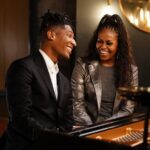 Michelle Obama Instagram - love, music, the healing power of art… and a little bit of piano magic with @michelleobama and @jonbatiste 🎹 🎶 American Symphony is now playing on Netflix.