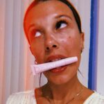 Millie Bobby Brown Instagram – thriving with my tinted lip oil by yours truly @florencebymills !! my best friend on vacay 💜 what are you doing?? go order some!