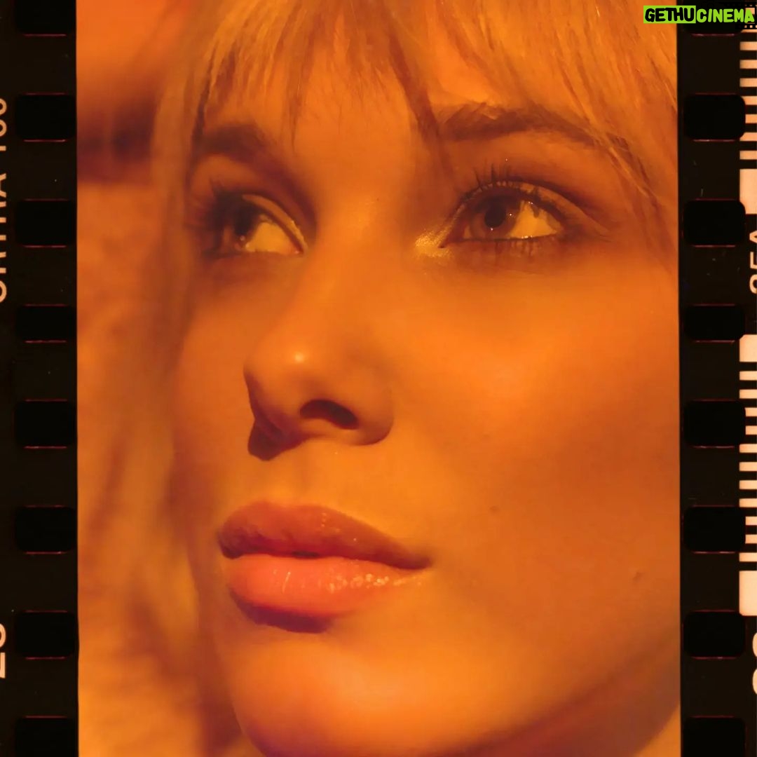 Millie Bobby Brown Instagram - love a little retro glam with @florencebymills 🧡🎞️ here’s what I used: - cosmic shadow (cusp) on inner eye corner - what’s my line? longwear eyeliner (action) waterline - out of this whirled marble bronzer (cool tone) - self-reflecting highlighter (self-love) - tint n tame eye brow pencil (light brown) - mark my words lip liner (poised) - work it pout plumping lip gloss (sunny hunny)