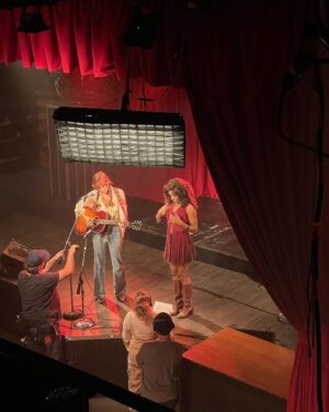 Nabiyah Be Instagram - First 3 episodes of @daisyjonesandthesix are now streaming on @primevideo ! 1) Simone posing with her first album at @thetroubadour 2) studio rehearsal for Song For You at @soundcitystudios , Riley was recording next door and caught the rehearsal while on break 3) BTS of when Daisy and Simone first met and Riley was SO HAPPY because we got Vegan Pizza on set! 4) and 5) me doing a terrible job of showing the house party in which Simone and Bernie ( @ayesharaasheed ) first meet. 6) Simone posing with her first album’s track list 7) Simone and Daisy’s first performance together, Daisy’s first performance ever 8) @rebeccawmakeup giving me the glam 9) Riley being a professional napper at 3:30 am 10) me at Simone’s apartment in which I actually don’t show you the apartment at all 🤪